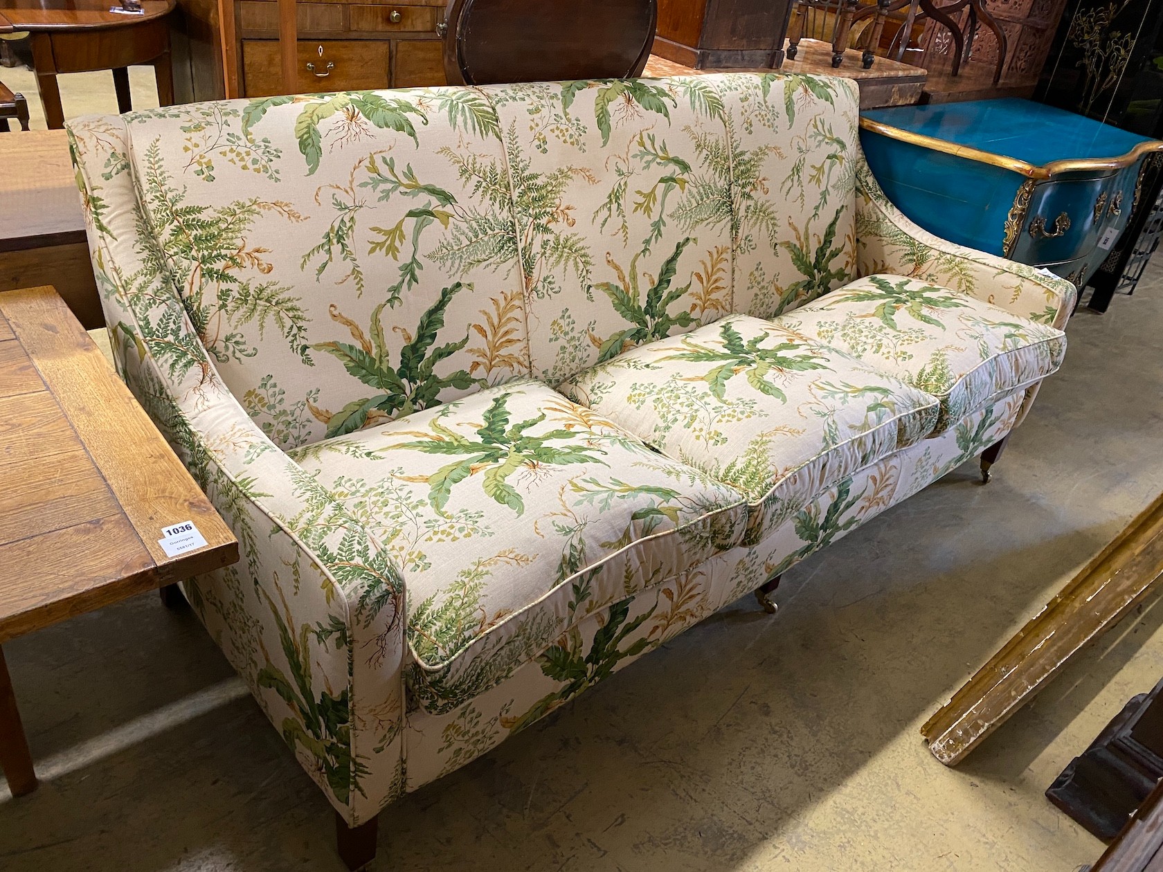 A “Highly Sprung Ltd” Colefax and Fowler fabric three seater sofa with feather cushion seats, width 210, depth 86cm, height 90cm.